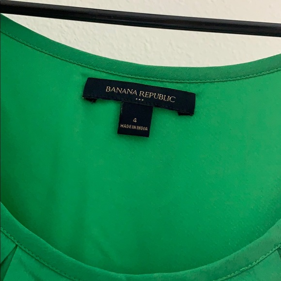 Green A-line dress with front pleats. - Picture 2 of 4